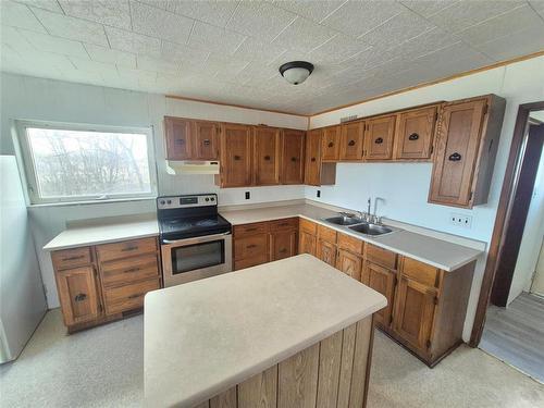 54 Lokier Street N, Glenella, MB - Indoor Photo Showing Kitchen With Double Sink