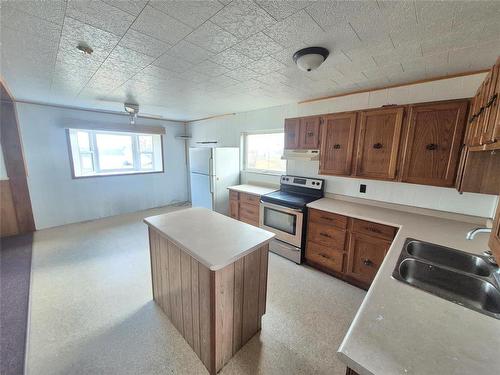 54 Lokier Street N, Glenella, MB - Indoor Photo Showing Kitchen With Double Sink