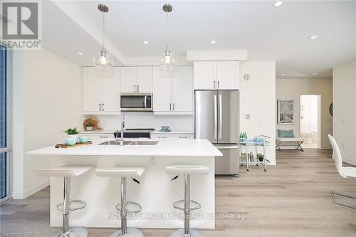 606 - 118 West Street, Port Colborne, ON - Indoor Photo Showing Kitchen With Stainless Steel Kitchen With Double Sink With Upgraded Kitchen