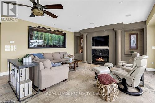 11 - 88 Lakeport Road, St. Catharines, ON - Indoor Photo Showing Living Room With Fireplace