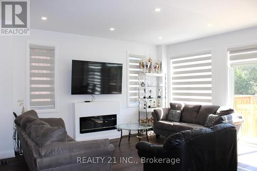 75 Chelliah Court S, Toronto, ON - Indoor Photo Showing Living Room With Fireplace