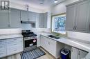 108 Central Avenue, Love, SK  - Indoor Photo Showing Kitchen With Double Sink 