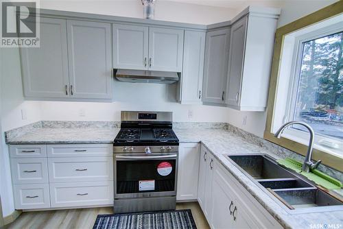 108 Central Avenue, Love, SK - Indoor Photo Showing Kitchen With Double Sink