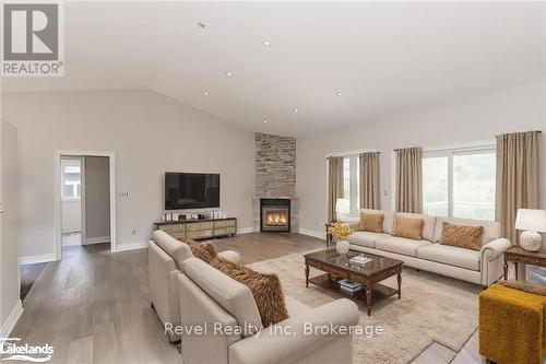 Lot 22 Voyageur Drive, Tiny, ON - Indoor Photo Showing Living Room With Fireplace