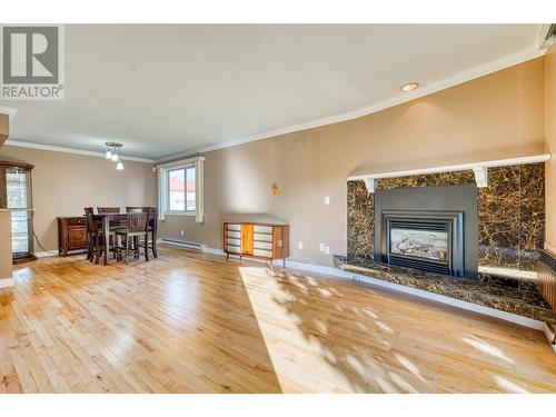 335 Churchill Avenue Unit# 101, Penticton, BC - Indoor Photo Showing Living Room With Fireplace