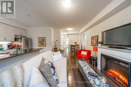 35 Conarty Crescent, Whitby, ON - Indoor Photo Showing Living Room With Fireplace