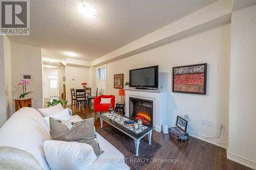 35 Conarty Crescent, Whitby, ON - Indoor Photo Showing Living Room With Fireplace