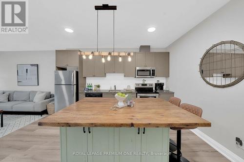 203 - 43 Dale Drive, New Tecumseth, ON - Indoor Photo Showing Kitchen With Stainless Steel Kitchen