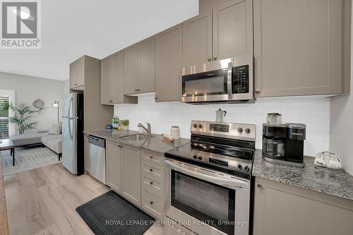 203 - 43 Dale Drive, New Tecumseth, ON - Indoor Photo Showing Kitchen With Stainless Steel Kitchen With Upgraded Kitchen