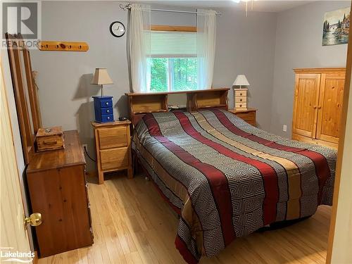 Bedroom with light hardwood / wood-style floors - 1010 Fern Glen Road, Emsdale, ON - Indoor Photo Showing Bedroom