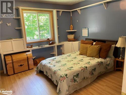 Bedroom featuring light hardwood / wood-style flooring - 1010 Fern Glen Road, Emsdale, ON - Indoor Photo Showing Bedroom