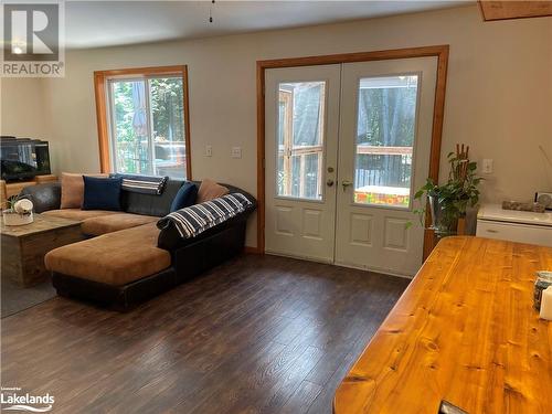 Living room featuring french doors and dark hardwood / wood-style floors - 1010 Fern Glen Road, Emsdale, ON - Indoor Photo Showing Living Room