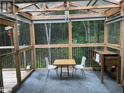 Unfurnished sunroom featuring vaulted ceiling - 1010 Fern Glen Road, Emsdale, ON -  With Deck Patio Veranda With Exterior