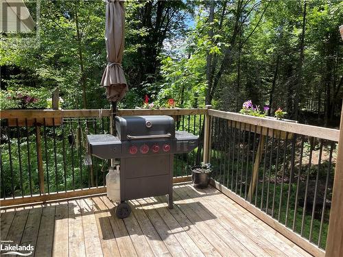 Wooden terrace featuring area for grilling - 1010 Fern Glen Road, Emsdale, ON - Outdoor With Deck Patio Veranda