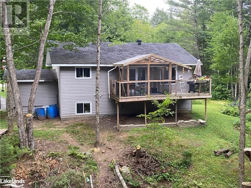 Back of house with a deck and a sunroom - 1010 Fern Glen Road, Emsdale, ON - Outdoor With Deck Patio Veranda