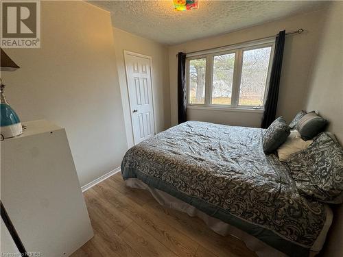 Bedroom with light hardwood / wood-style floors and a textured ceiling - 3877 Hwy 17 E, Mattawa, ON - Indoor Photo Showing Bedroom