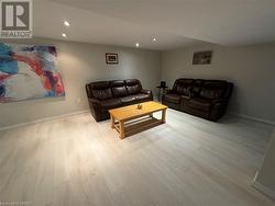 Living room with light hardwood / wood-style floors - 