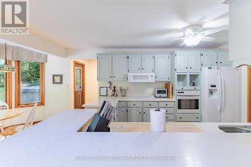 Kitchen w/ Corian counters - 10342 Beach O' Pines Road, Lambton Shores (Grand Bend), ON - Indoor Photo Showing Kitchen With Double Sink