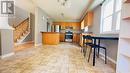 Kitchen with appliances with stainless steel finishes, an inviting chandelier, and sink - 753 Laurelwood Drive, Waterloo, ON  - Indoor Photo Showing Kitchen 