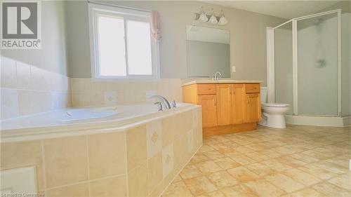 Full bathroom featuring tile patterned flooring, vanity, independent shower and bath, and toilet - 753 Laurelwood Drive, Waterloo, ON - Indoor Photo Showing Bathroom