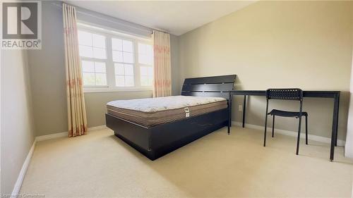 Bedroom featuring light colored carpet - 753 Laurelwood Drive, Waterloo, ON - Indoor Photo Showing Bedroom