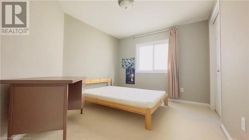 Carpeted bedroom featuring lofted ceiling - 753 Laurelwood Drive, Waterloo, ON - Indoor Photo Showing Bedroom