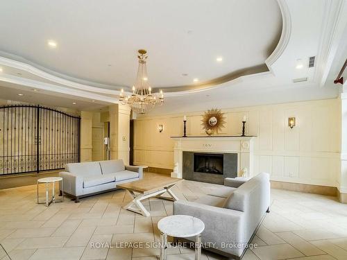 1019A-700 Humberwood Blvd, Toronto, ON - Indoor Photo Showing Living Room With Fireplace