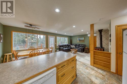 View looking over peninsula into living area and dining area - 4880 James Street, Fairmont Hot Springs, BC - Indoor