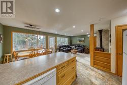 View looking over peninsula into living area and dining area - 