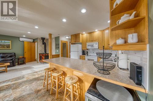 View of open plan layout from dining area - 4880 James Street, Fairmont Hot Springs, BC - Indoor