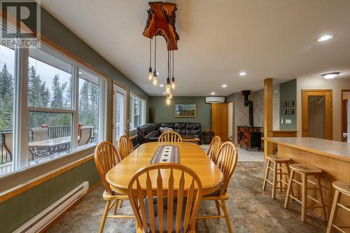 Dining area, through to living area - 4880 James Street, Fairmont Hot Springs, BC - Indoor Photo Showing Dining Room