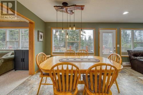 Dining area, with door to deck visible in the background - 4880 James Street, Fairmont Hot Springs, BC - Indoor Photo Showing Dining Room