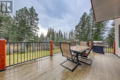 Large deck, accessed from living/dining area - 4880 James Street, Fairmont Hot Springs, BC - Outdoor With Deck Patio Veranda With Exterior