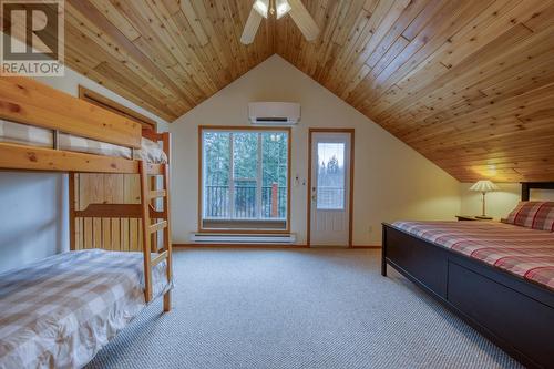 Primary bedroom - view to balcony door - 4880 James Street, Fairmont Hot Springs, BC - Indoor Photo Showing Bedroom