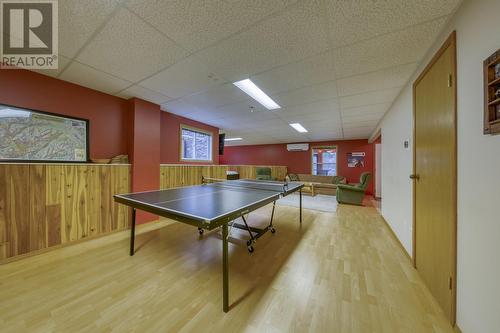 Games room with view through to family room - 4880 James Street, Fairmont Hot Springs, BC - Indoor