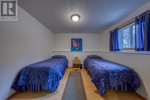 Bedroom 4 - door is just off the games room - 4880 James Street, Fairmont Hot Springs, BC - Indoor Photo Showing Bedroom