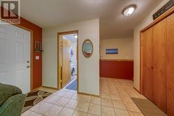 View from family room into half-bath and laundry room - 