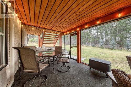 Screened in patio, walk-out from basement - 4880 James Street, Fairmont Hot Springs, BC - Outdoor With Deck Patio Veranda With Exterior