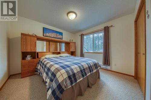 Bedroom 1 - to the right of the front door - 4880 James Street, Fairmont Hot Springs, BC - Indoor Photo Showing Bedroom