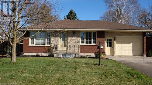 Ranch-style home with a garage and a front yard - 228 Byeland Drive, Mount Forest, ON - Outdoor