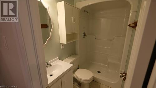 Bathroom with a shower, tile patterned flooring, toilet, and vanity - 228 Byeland Drive, Mount Forest, ON - Indoor Photo Showing Bathroom