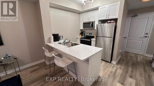 Open Concept Kitchen - 322 - 5055 Greenlane Road, Lincoln (981 - Lincoln Lake), ON - Indoor Photo Showing Kitchen With Double Sink