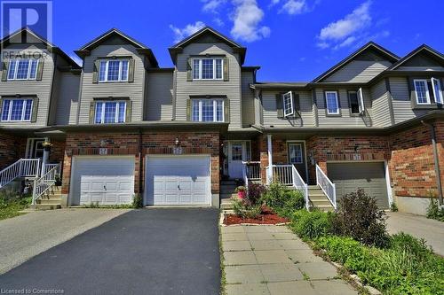 Multi unit property featuring a garage - 29 Madeleine Street, Kitchener, ON - Outdoor With Facade