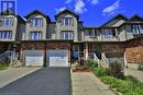 Multi unit property featuring a garage - 29 Madeleine Street, Kitchener, ON  - Outdoor With Facade 