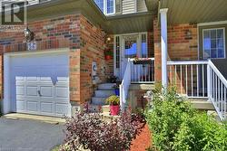 Doorway to property with a garage - 