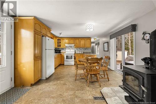 294 Route 525, Saint-Antoine, NB - Indoor Photo Showing Kitchen With Fireplace