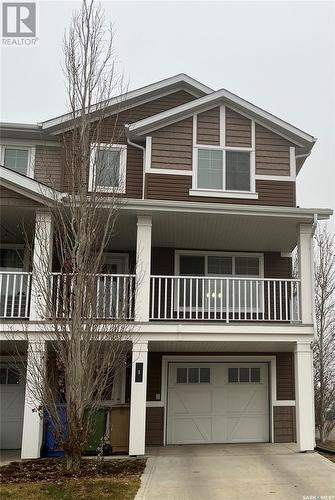 1 4545 Delhaye Way, Regina, SK - Outdoor With Balcony With Facade