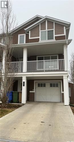 1 4545 Delhaye Way, Regina, SK - Outdoor With Balcony With Facade