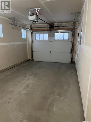 1 4545 Delhaye Way, Regina, SK - Indoor Photo Showing Garage