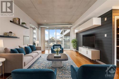 This photo has been virtually staged. - 349 Mcleod Street Unit#527, Ottawa, ON - Indoor Photo Showing Living Room